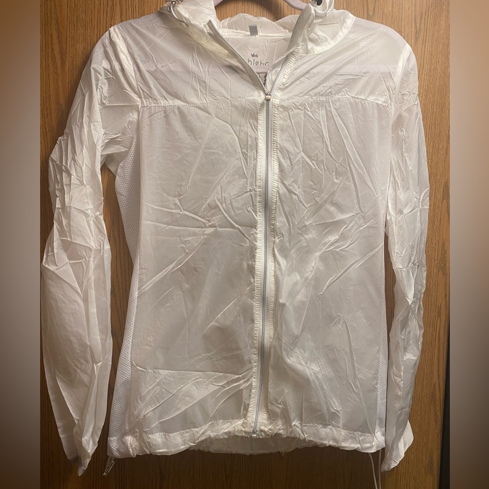 Thin white joggers athletic jacket. With ties on sides and small pocket in back